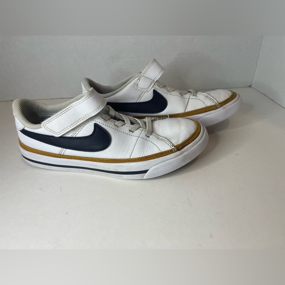 Nike Kids White and Black Sneakers with Gold Accents